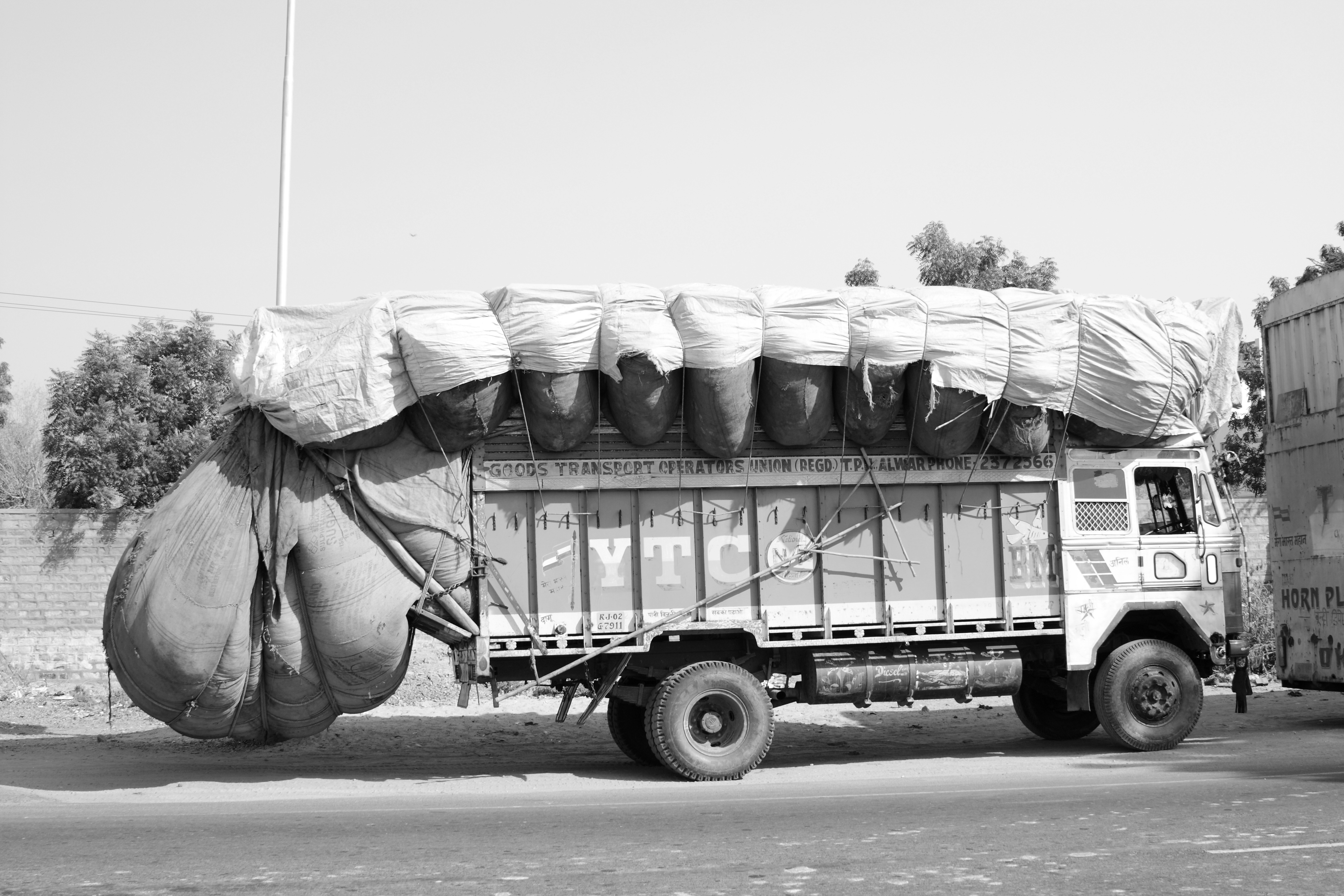 An overloaded truck representing limited transmission capacity